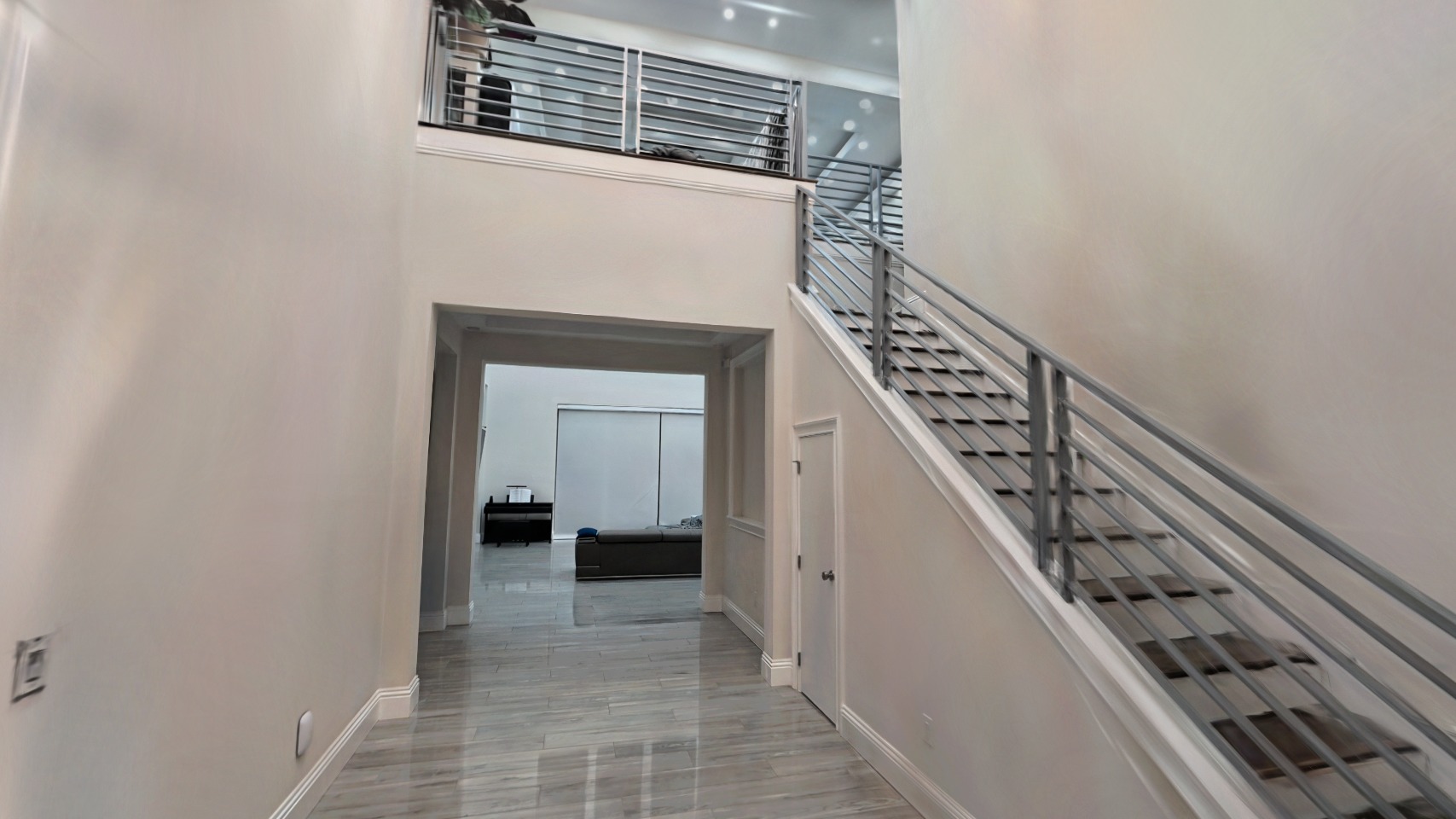 The foyer and staircase of a real Rendition capture, rendered from inside the tour
