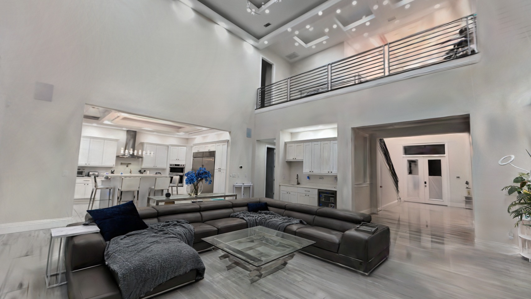 The two-story great room of a real Rendition capture, rendered from inside the tour
